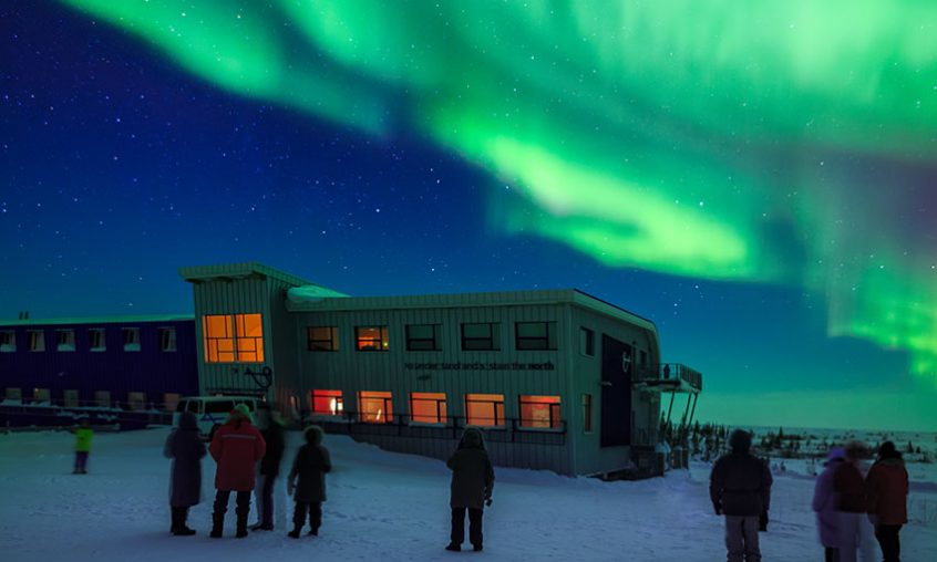 The Churchill Northern Studies Centre, a Canadian subartic research station, with northern lights (aurora borealis) lighting up the sky